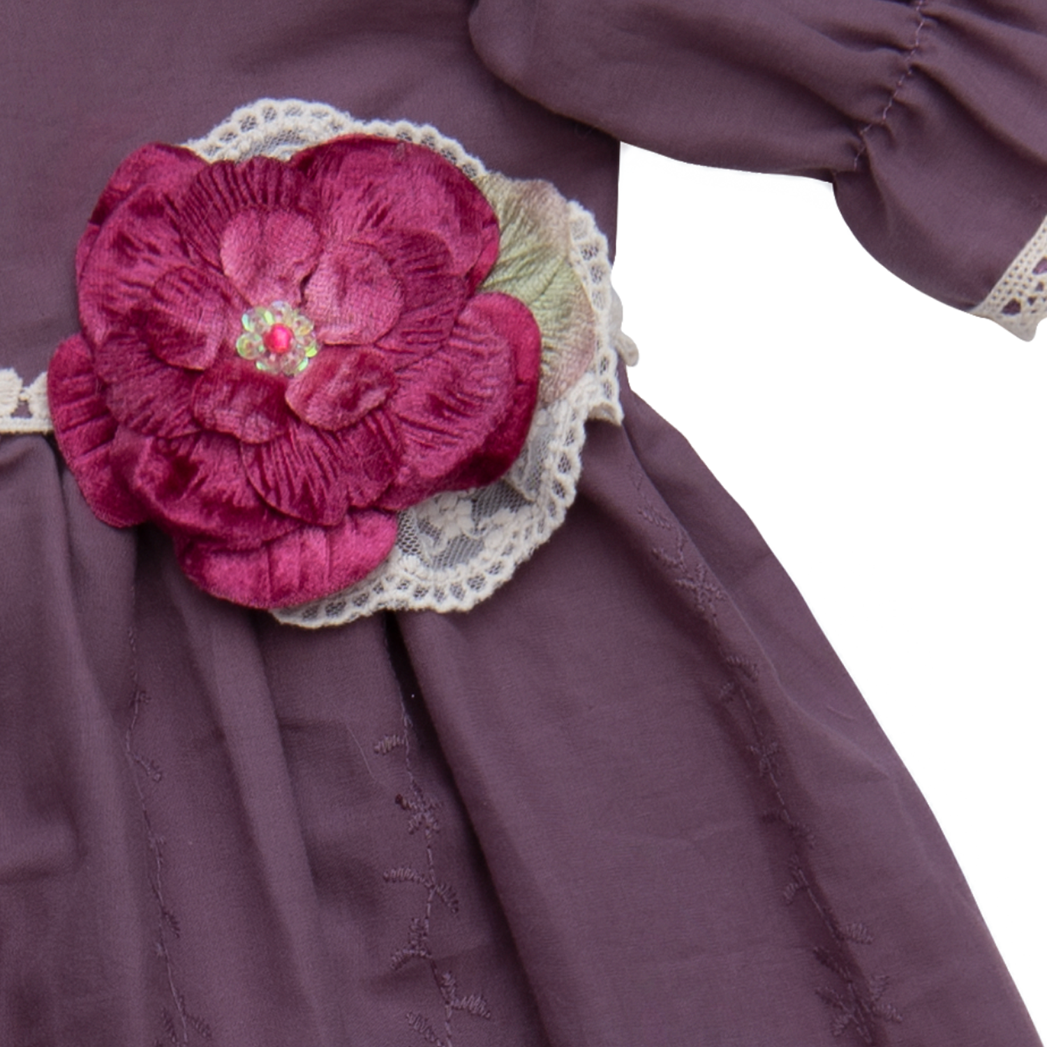 A beautiful baby gown in rich purple fabric with intricate crocheted lace detailing, perfect for special occasions.