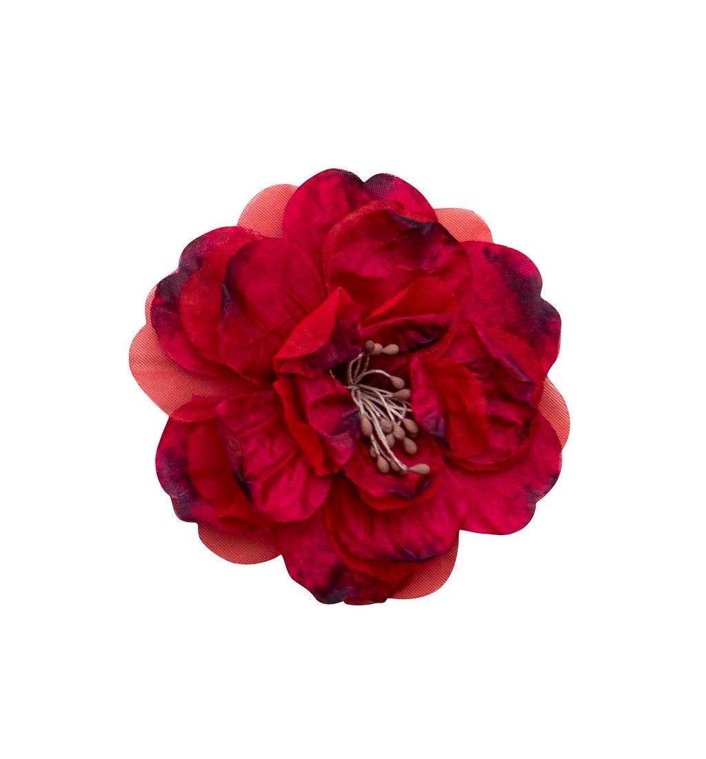 A colorful Wild Bloom Clippie featuring a vibrant floral pattern, perfect for stylish hairdos.