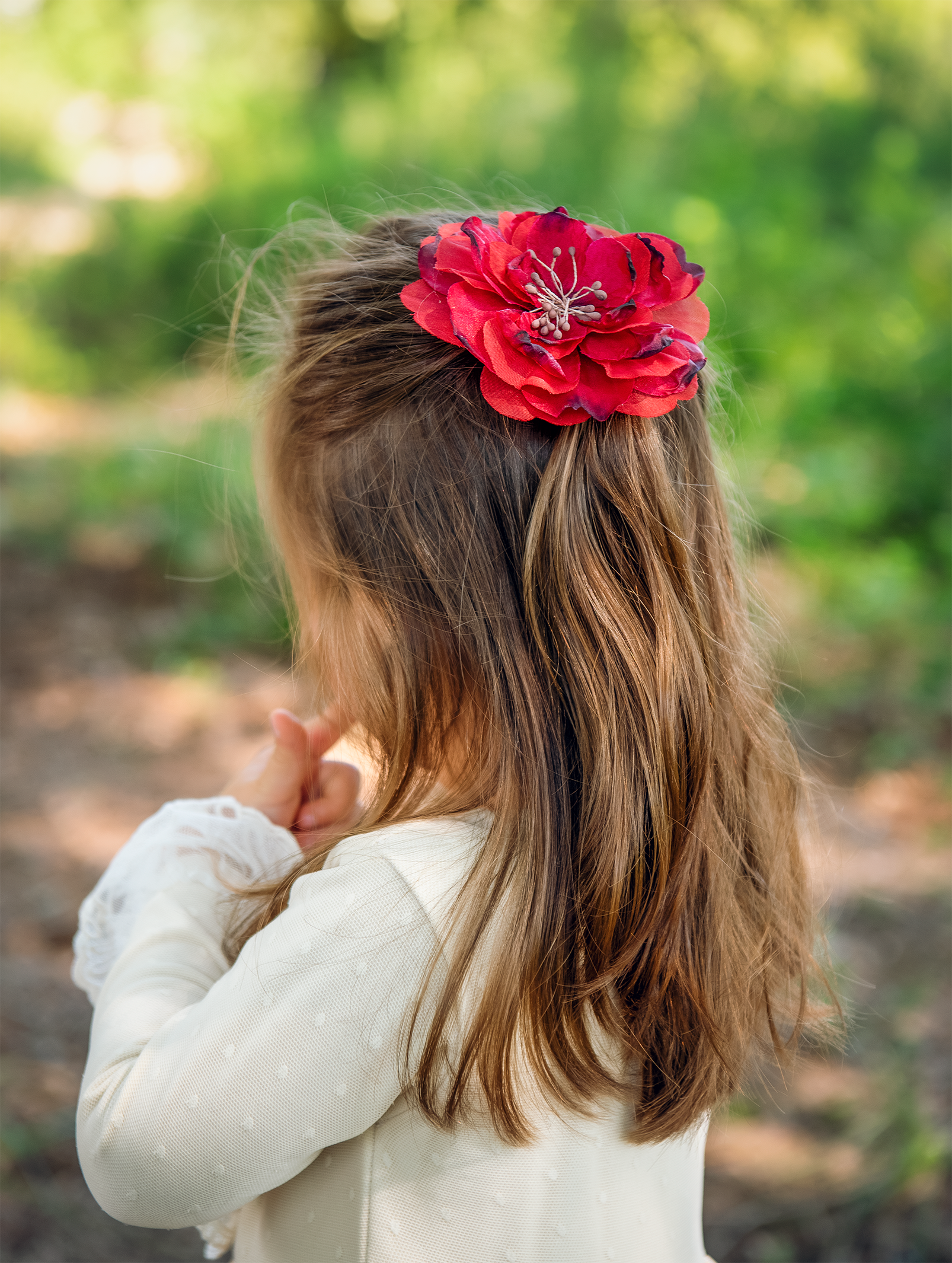 A colorful Wild Bloom Clippie featuring a vibrant floral pattern, perfect for stylish hairdos.