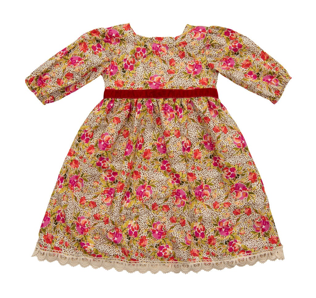 A vibrant Wild Bloom Dress featuring a stunning floral pattern in bright colors, perfect for summer occasions.