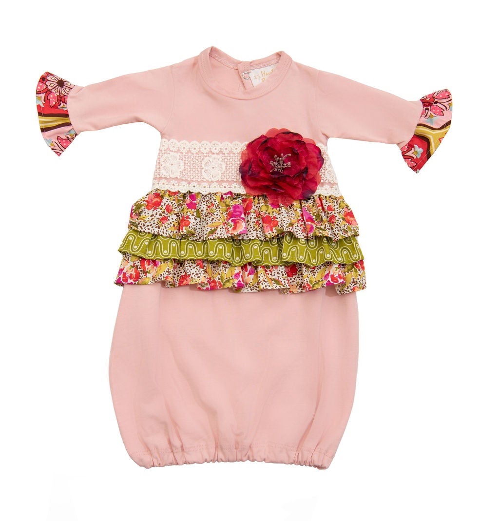 A vibrant Wild Bloom Gown featuring a beautiful floral pattern, perfect for newborns and infants.