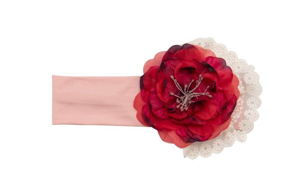 A vibrant Wild Bloom Headband featuring a colorful floral pattern, perfect for stylish hair accessories.