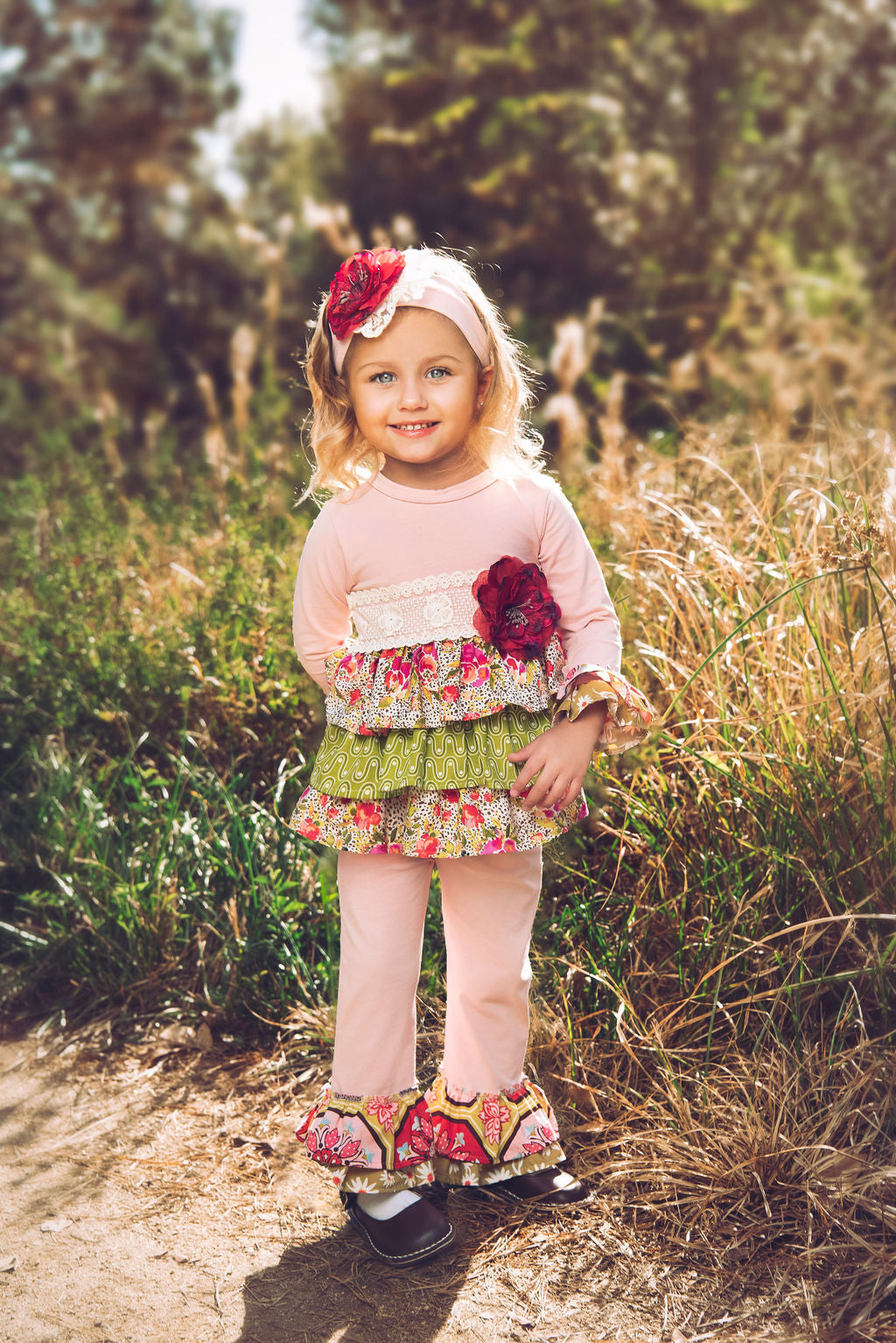 Wild Bloom Swing Set featuring bright colors and floral patterns, designed for children's outdoor play.