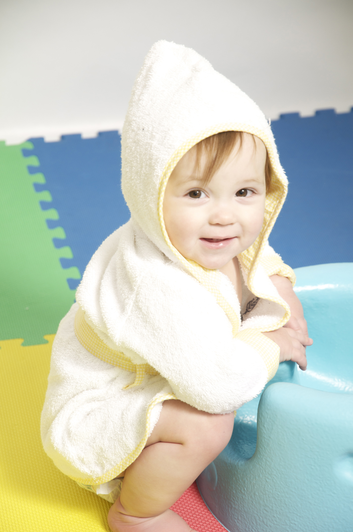 Bambini Blank Terry Robe in white with matching booties, designed for infants, featuring a hood for warmth and comfort.