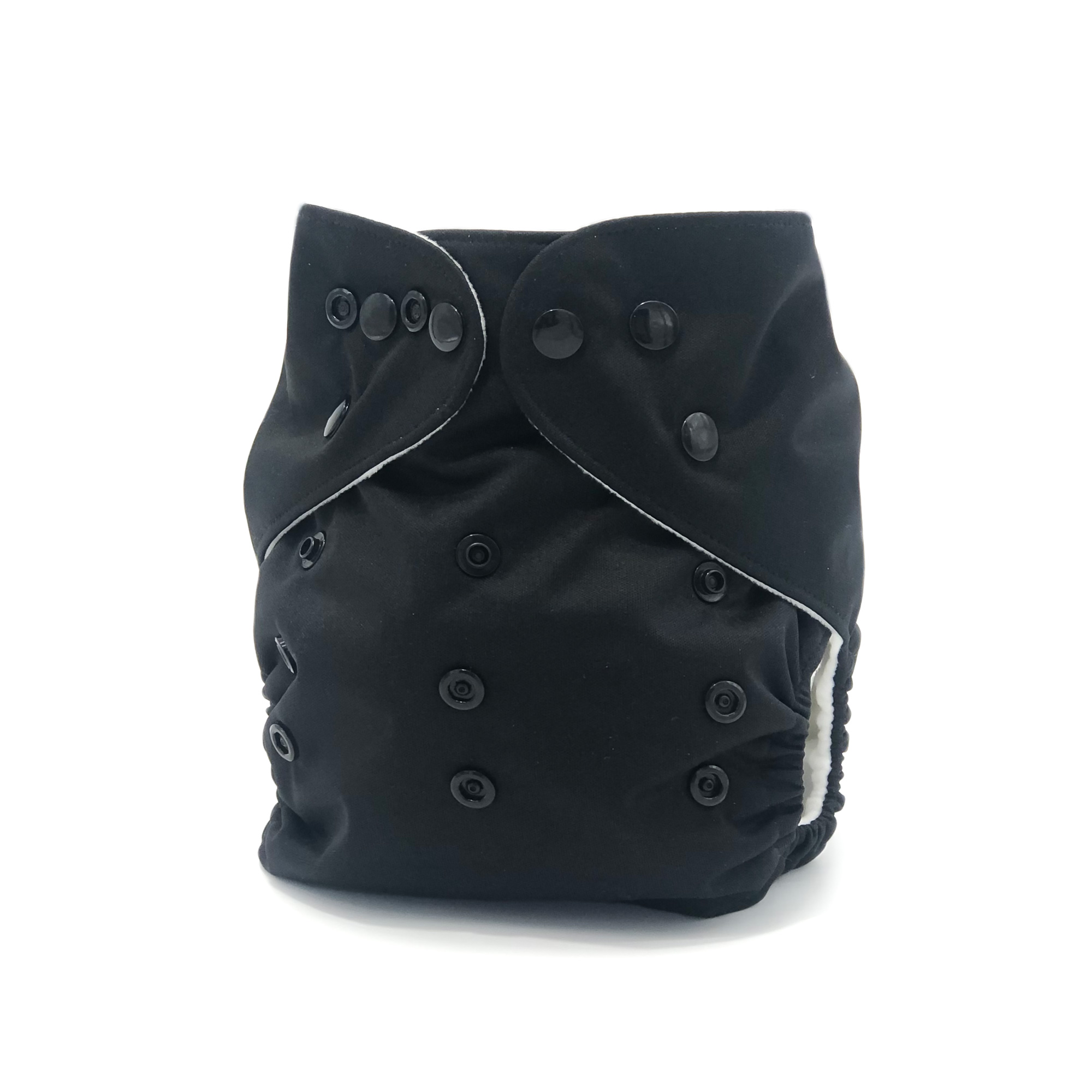 Licorice Cloth Diaper in solid black with matching snaps, showcasing its sleek design and microfiber insert.