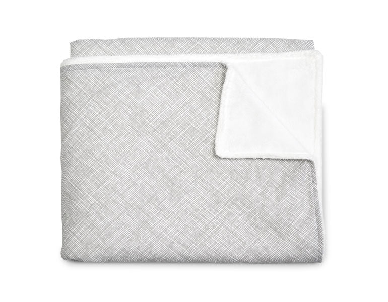 Avi Baby Blanket featuring modern design with neutral tones and playful lines, made from 100% cotton percale and soft minky fabric.