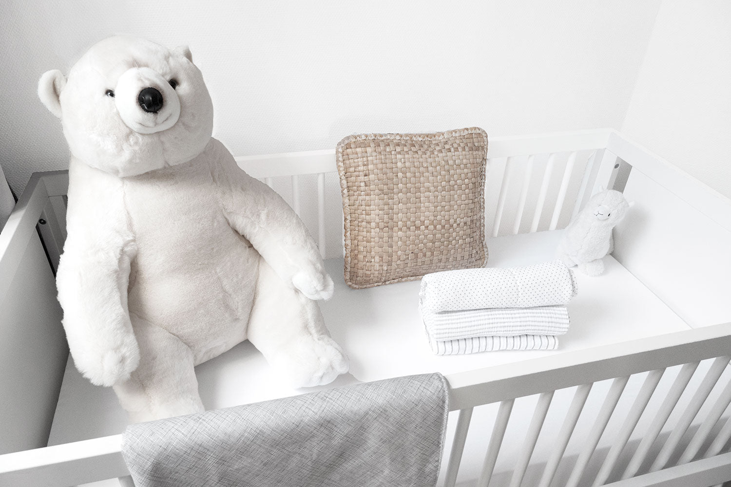 Avi Baby Blanket featuring modern design with neutral tones and playful lines, made from 100% cotton percale and soft minky fabric.