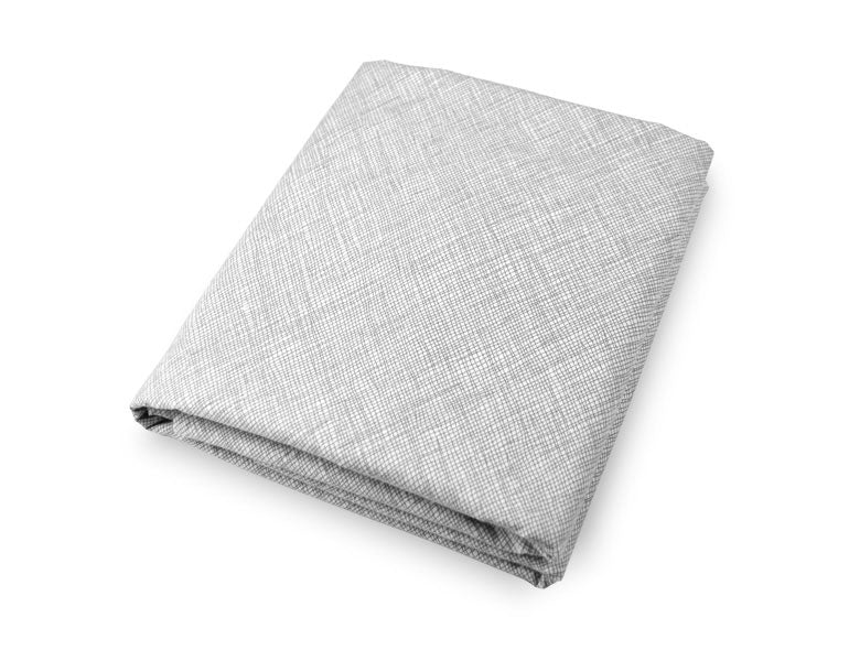 Avi Fitted Crib Sheet featuring modern neutral tones and sporadic lines, designed for a stylish nursery.