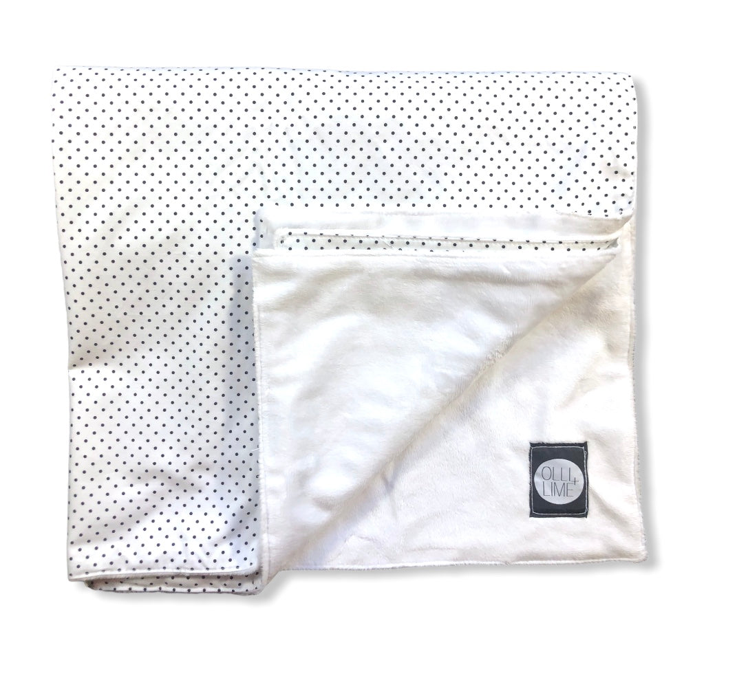 Connect the Dots Baby Blanket featuring a modern black and white dot design, made from 100% cotton percale with a soft minky backing.