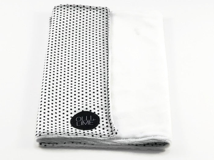 Connect the Dots Baby Blanket featuring a modern black and white dot design, made from 100% cotton percale with a soft minky backing.