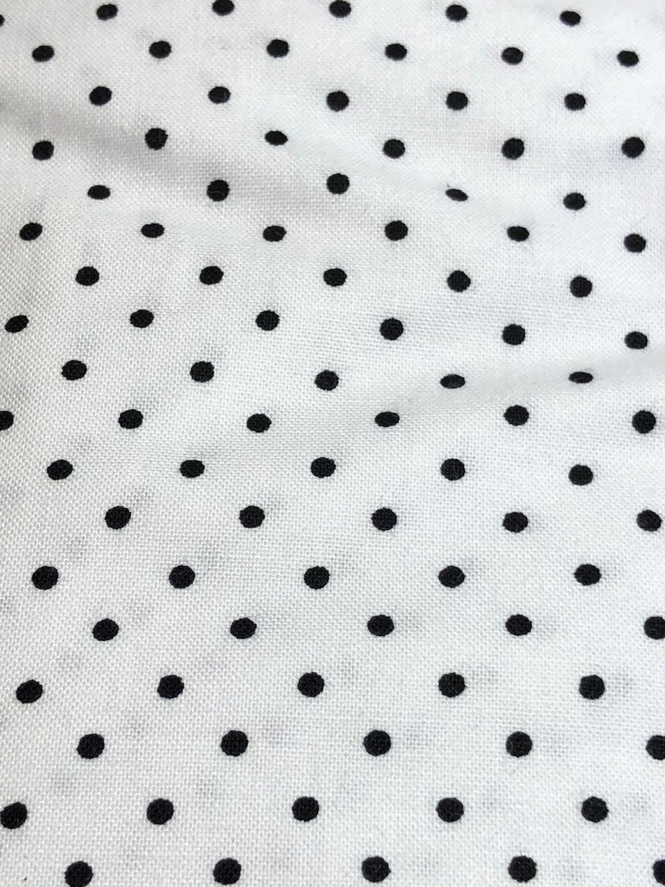 Connect the Dots Baby Blanket featuring a modern black and white dot design, made from 100% cotton percale with a soft minky backing.