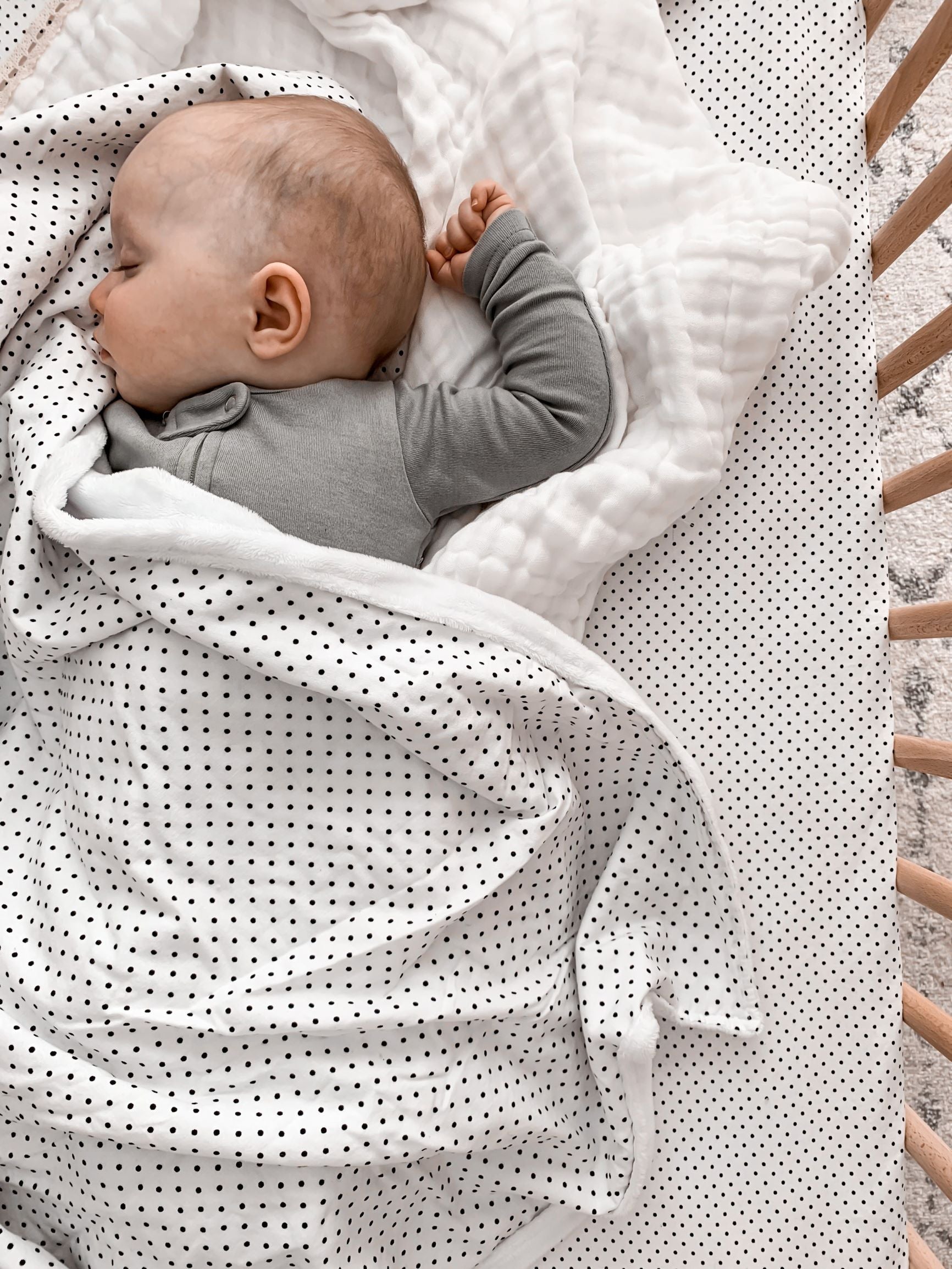 Connect the Dots Classic Crib Bedding Set featuring black dots on a white background, including a crib sheet, skirt, and soft blanket.