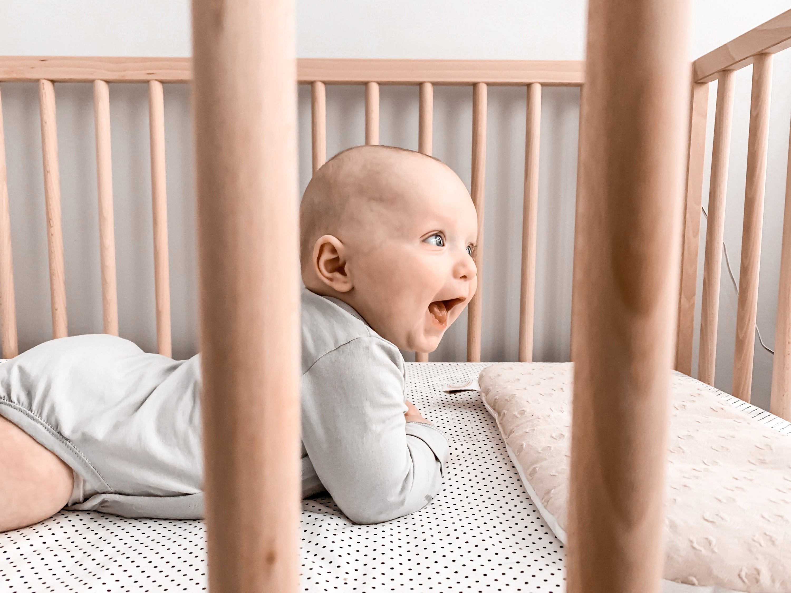 Connect the Dots Fitted Crib Sheet featuring playful black dots on a white background, made from 100% cotton percale for ultimate comfort.