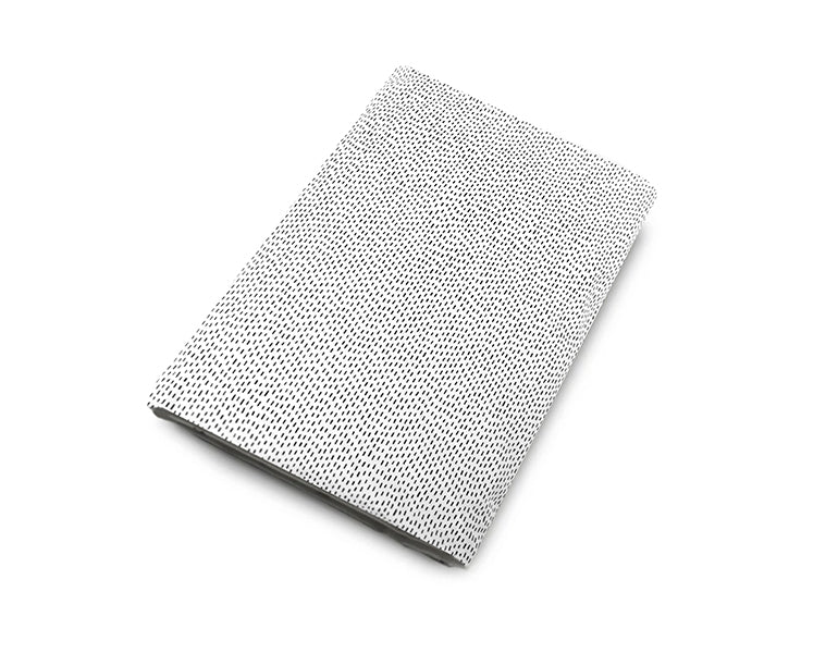 Dashing Fitted Crib Sheet with Tiny Dash design in black and white, made from 100% cotton percale, perfect for modern nurseries.