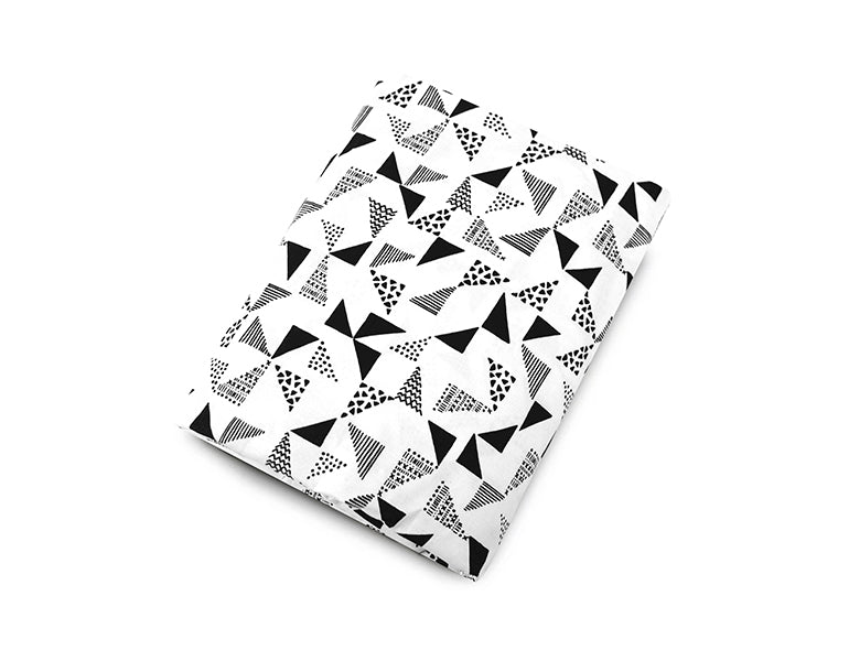 Felix & Marti Fitted Crib Sheet featuring a modern multi-triangle design in soft cotton percale fabric, perfect for a stylish nursery.