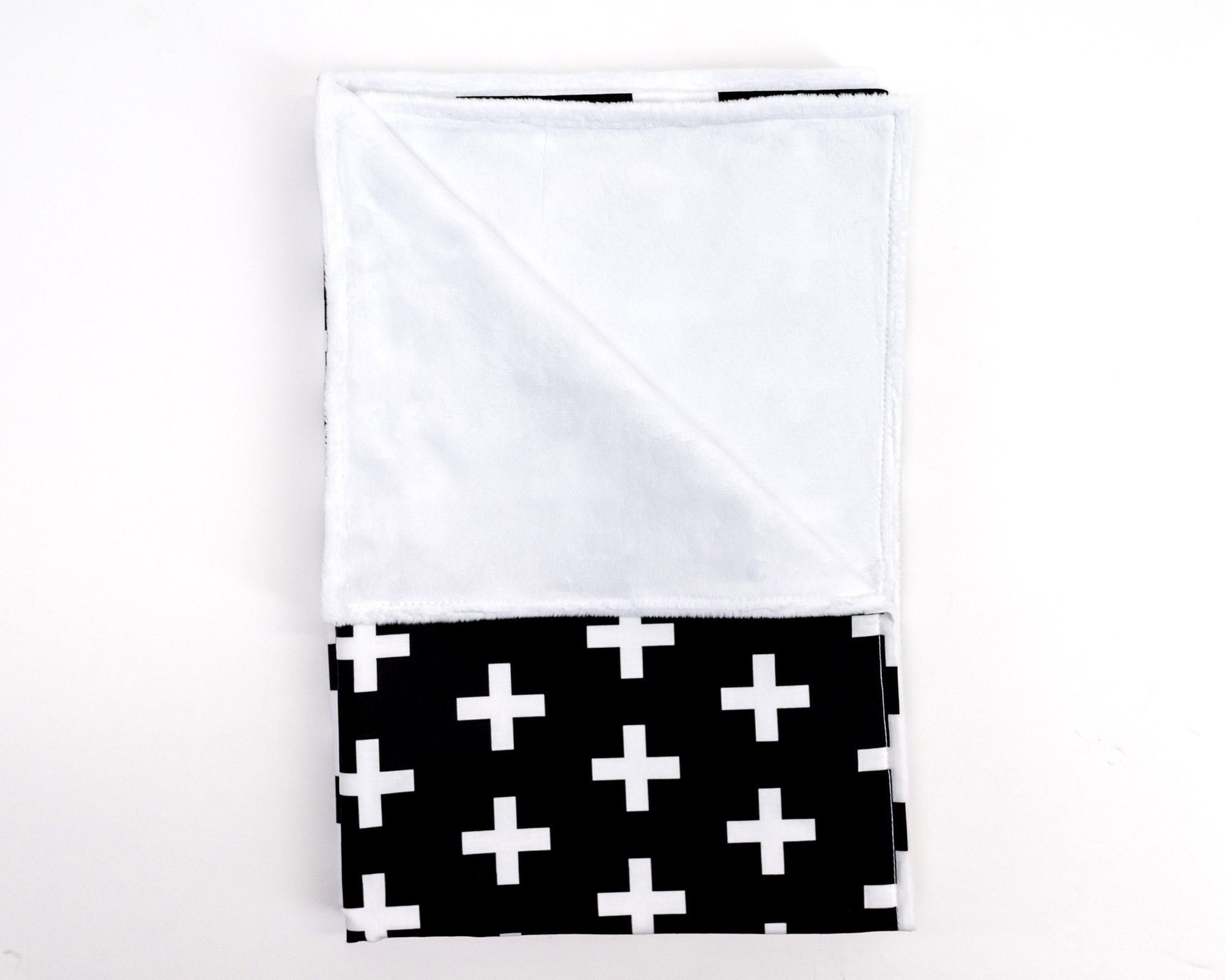 Finn Baby Blanket featuring a large white Swiss cross on a black background, made from 100% premium cotton with a soft minky backing.