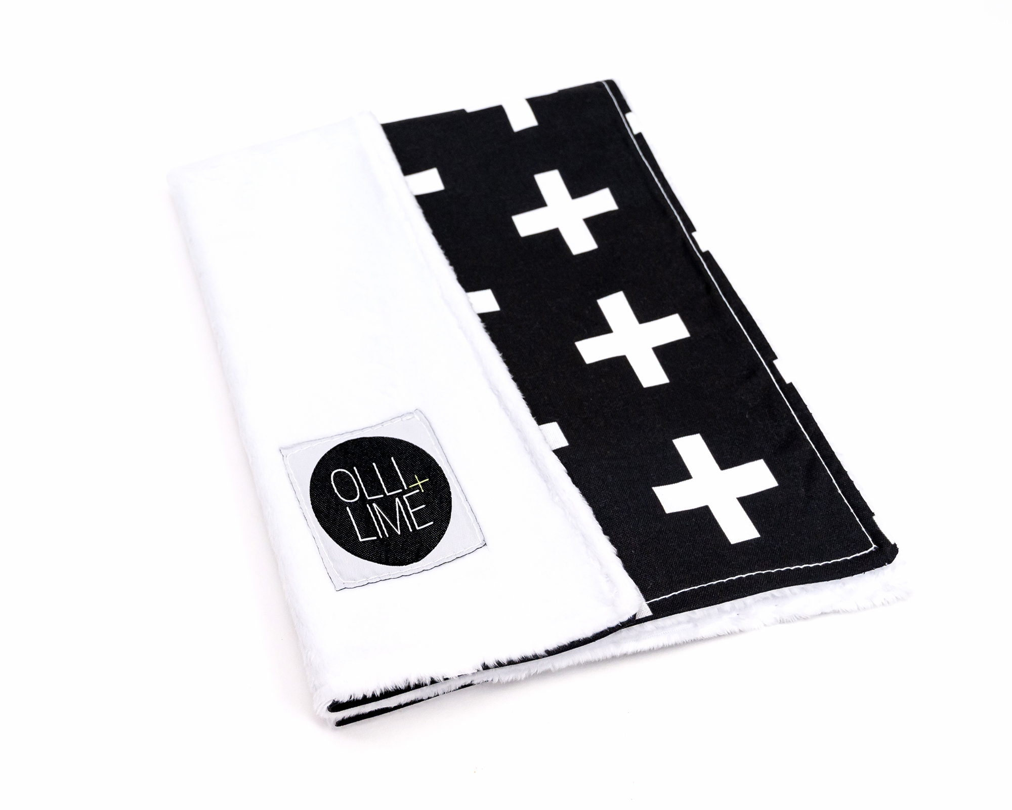 Finn Lovey security blanket featuring a white Swiss cross pattern on a black background, made from premium cotton with a soft minky backing.