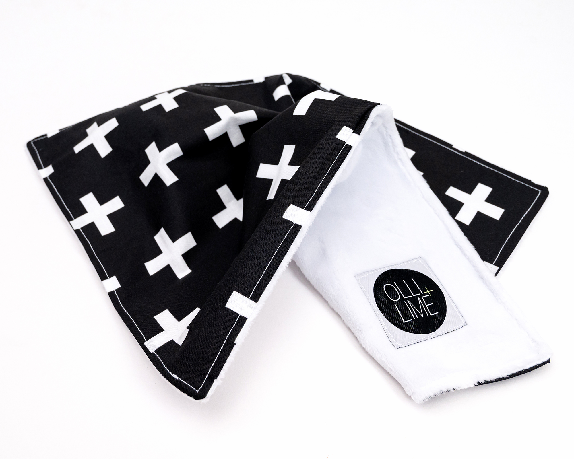 Finn Lovey security blanket featuring a white Swiss cross pattern on a black background, made from premium cotton with a soft minky backing.