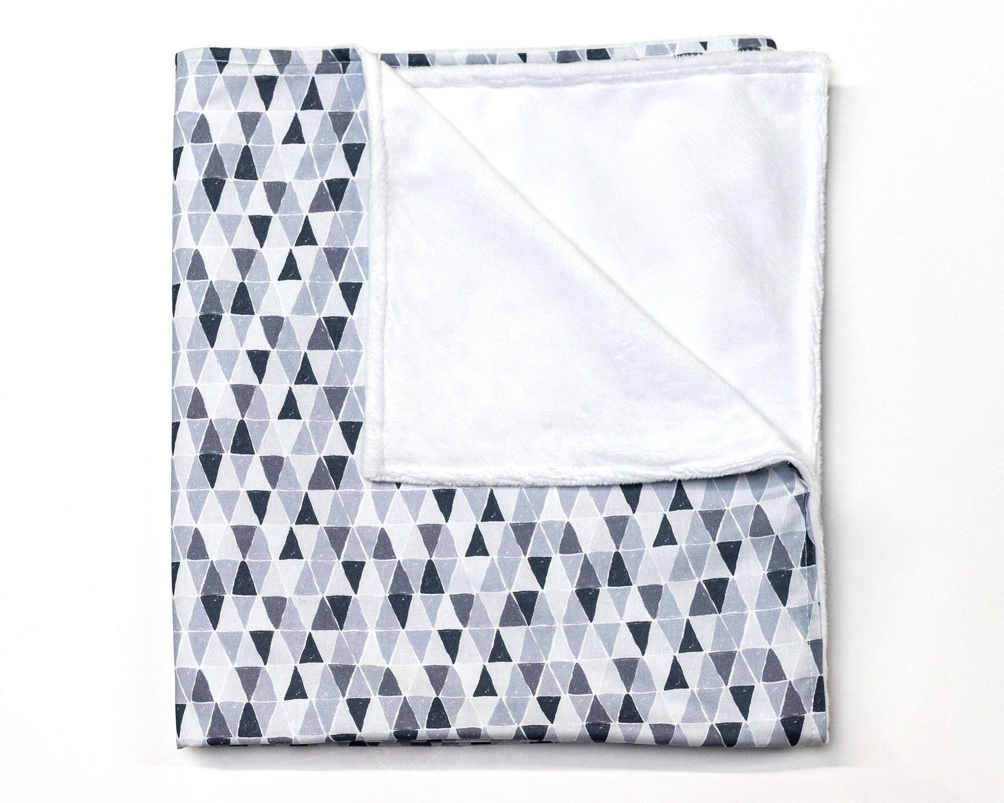 Gray Banners Marching Deluxe Crib Bedding Set featuring modern gray triangle patterns and soft cotton materials.