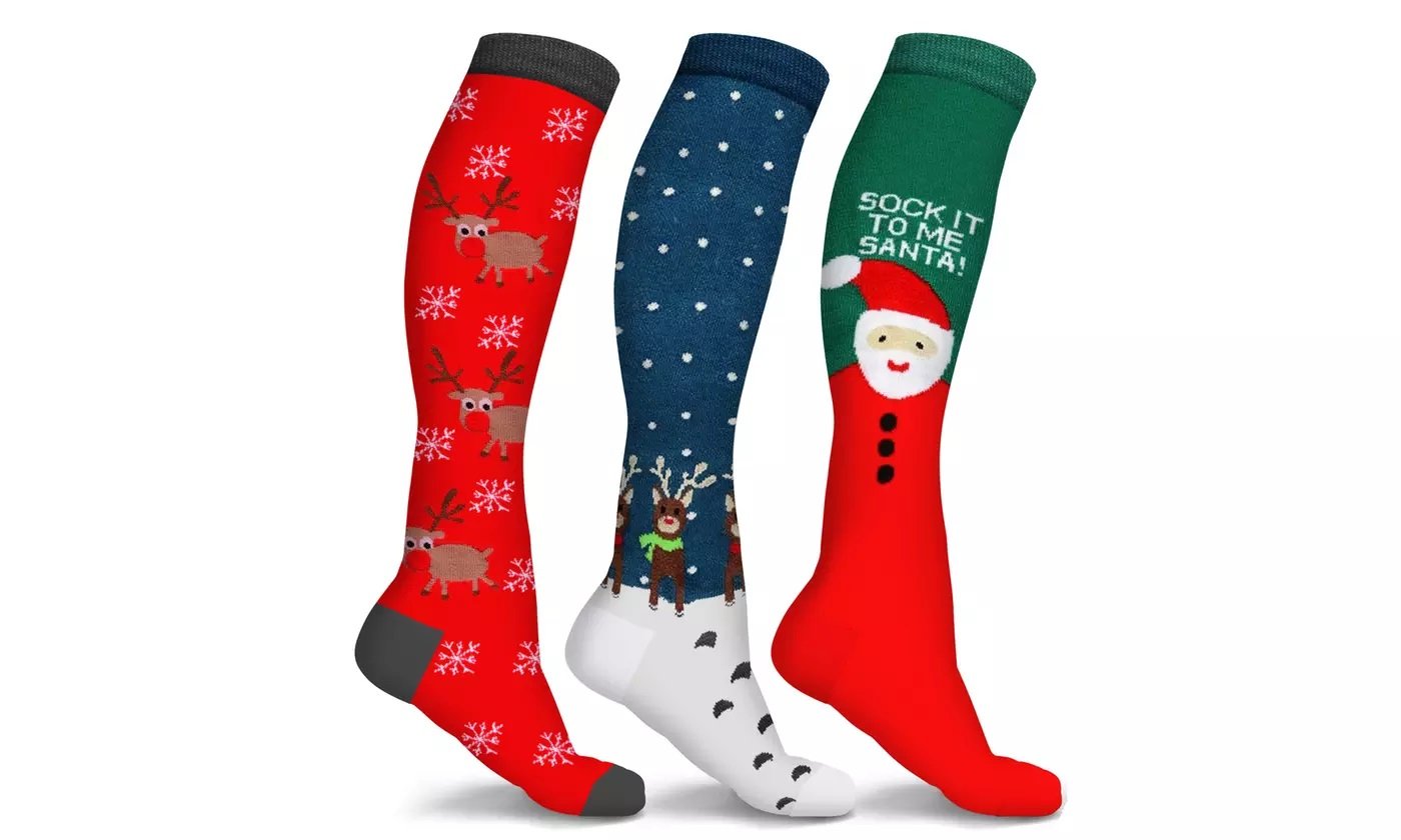 Three pairs of Holiday Fun Knee High Compression Socks featuring festive designs like reindeer and candy cane, showcasing their knee-high length and vibrant colors.