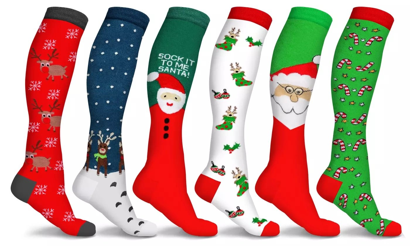 Three pairs of Holiday Fun Knee High Compression Socks featuring festive designs like reindeer and candy cane, showcasing their knee-high length and vibrant colors.