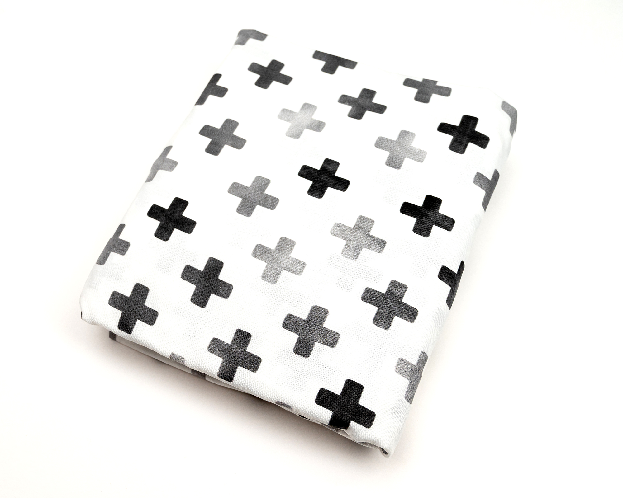 Hugo's Hazy Cross Deluxe Crib Bedding Set featuring gray Swiss cross pattern on white background, includes crib skirt, fitted sheet, baby blanket, and lovey.