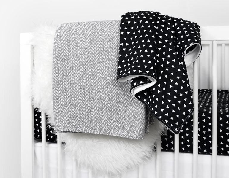 Kingsley Baby Blanket featuring modern triangle design in black and white, soft cotton front and minky back.