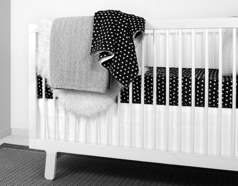 Kingsley Baby Blanket featuring modern triangle design in black and white, soft cotton front and minky back.