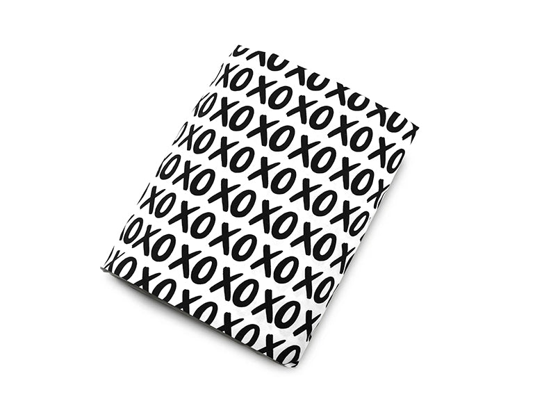 Mega XO Fitted Crib Sheet featuring black X's and O's on a white background, designed for modern nurseries.