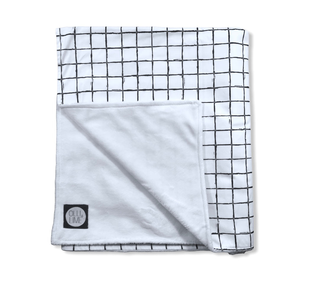 Luca Baby Blanket featuring a modern black grid pattern with soft white minky backing, perfect for stylish nurseries.