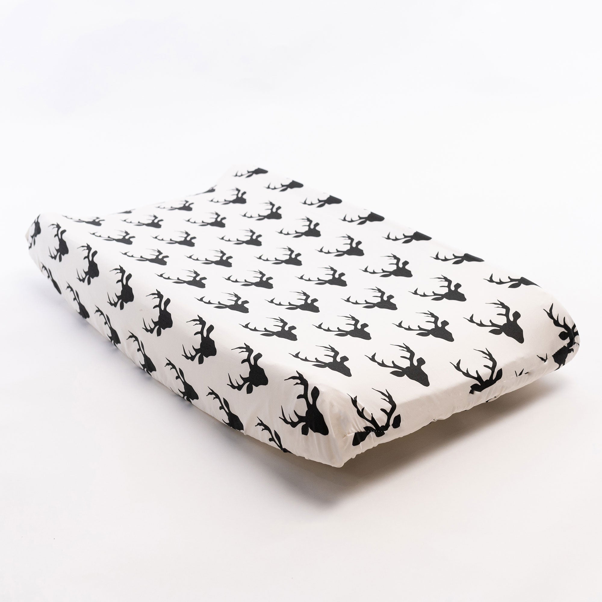 Mila Changing Pad Cover featuring a modern deer design in soft cotton fabric, perfect for a stylish nursery.