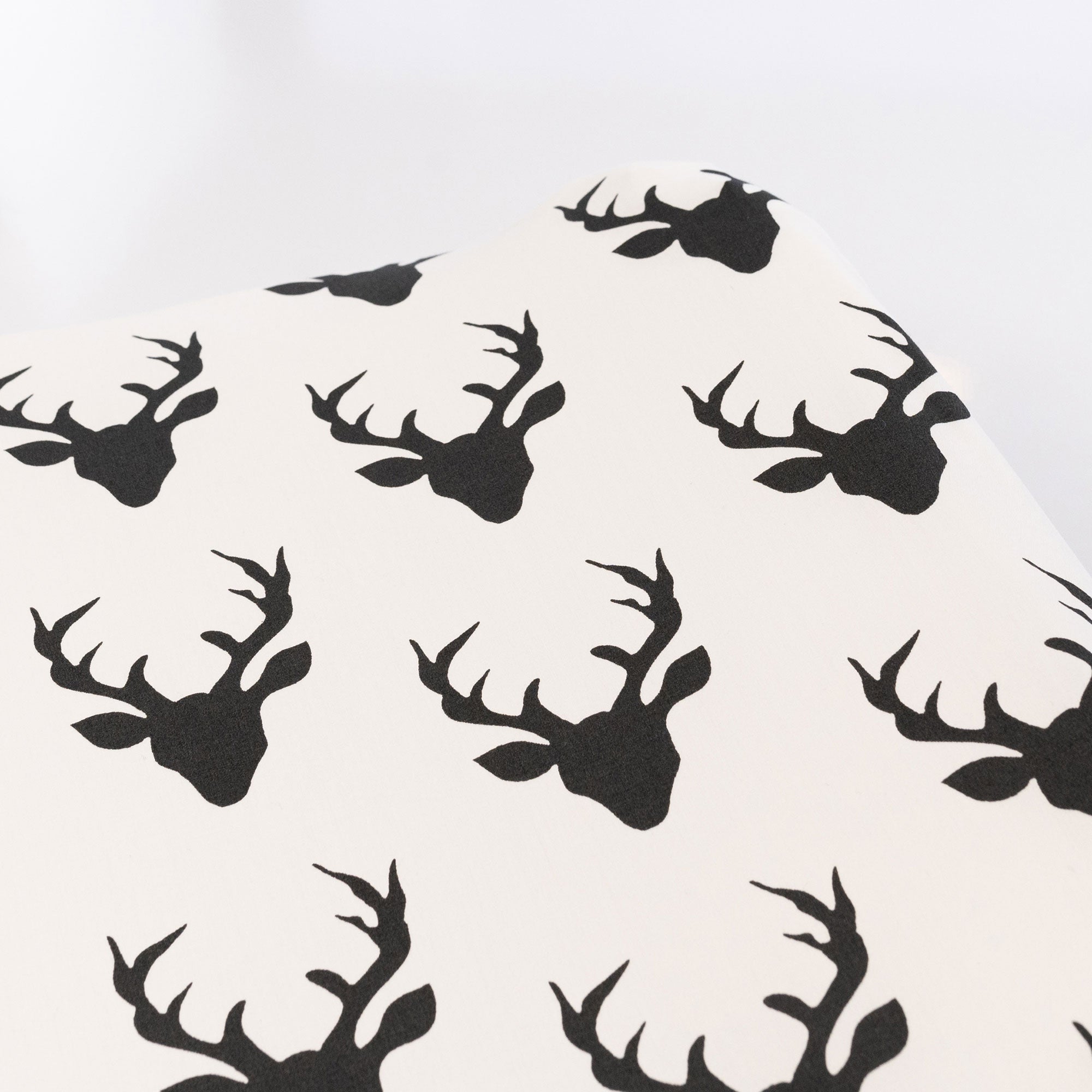 Mila Changing Pad Cover featuring a modern deer design in soft cotton fabric, perfect for a stylish nursery.