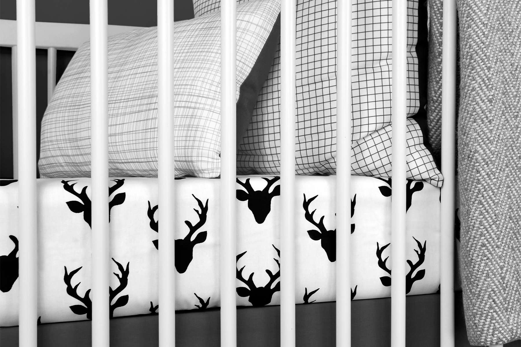 Mila Classic Crib Bedding Set featuring modern woodland deer design in soft cotton fabric, including a plush minky blanket and fitted sheet.