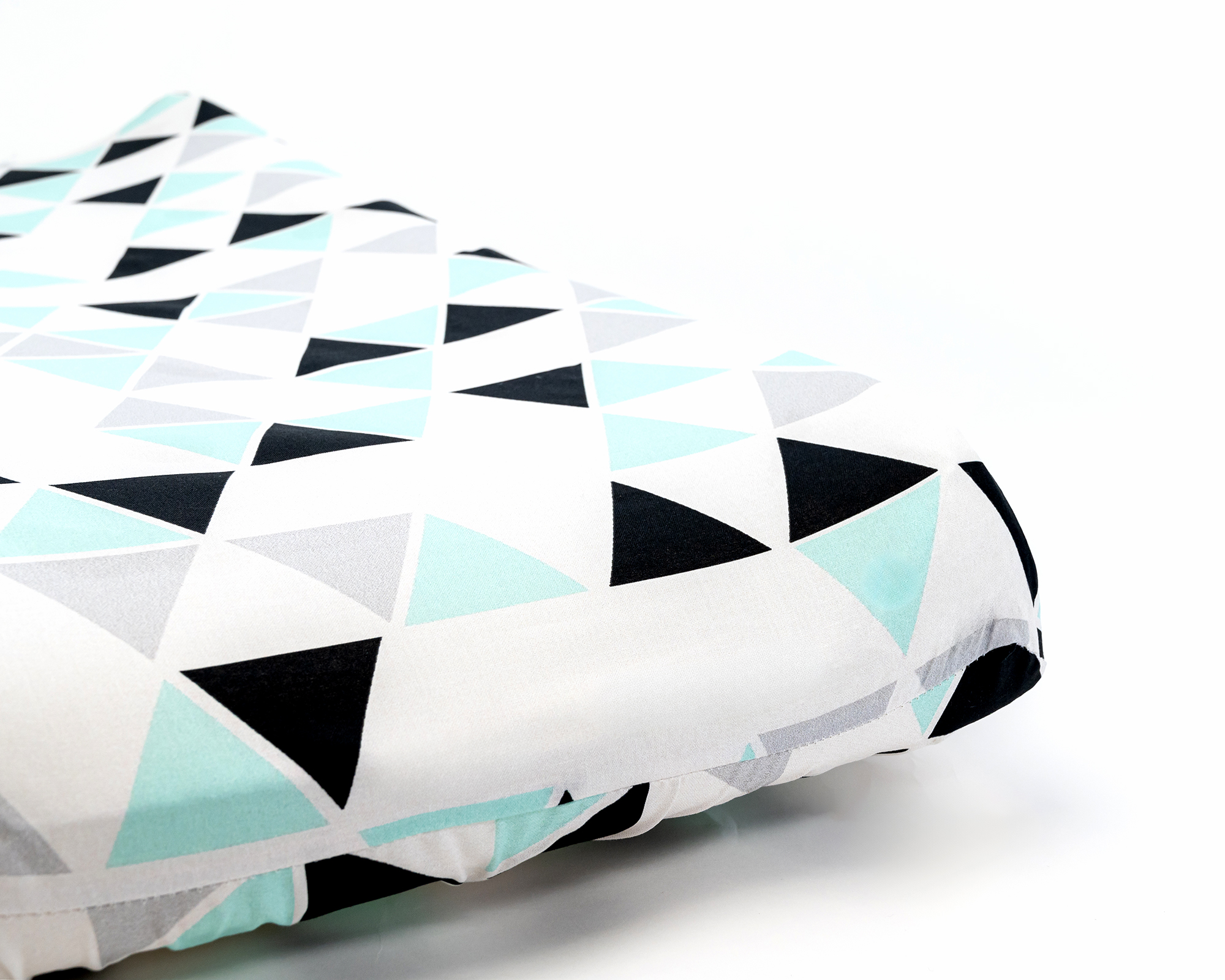 Minty Origami Changing Pad Cover featuring mint, gray, and black triangles on a white background, made from 100% premium cotton.