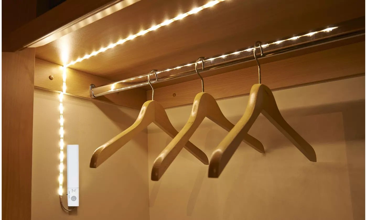 Motion Sensor LED Light Strips measuring 6.5 feet, ideal for wardrobe, bathroom, and stair lighting, featuring a motion-activated sensor and adhesive backing.