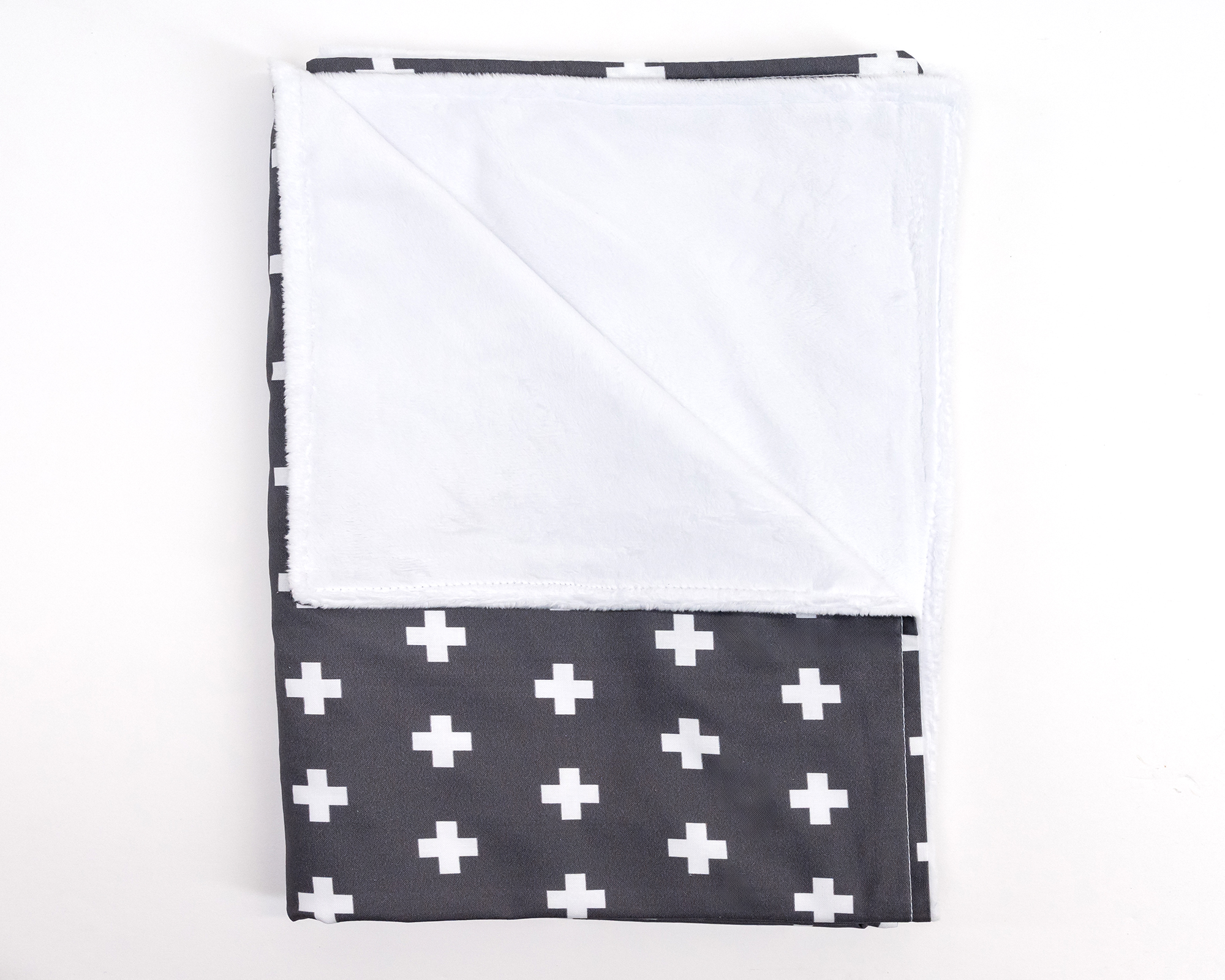 Nils Baby Blanket featuring a white Swiss cross pattern on a dark gray background, made from premium cotton.