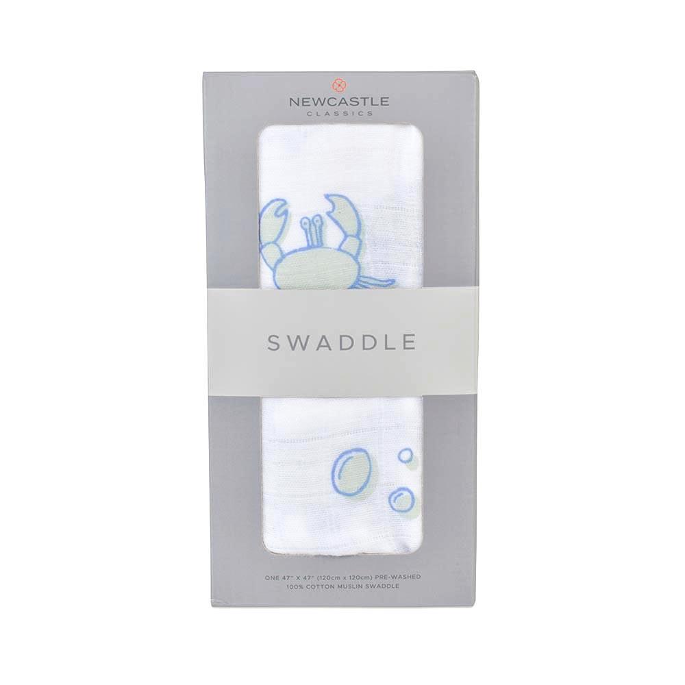 Ocean Swaddle made from 100% natural cotton muslin, featuring a soft and breathable design in a calming ocean-themed pattern.