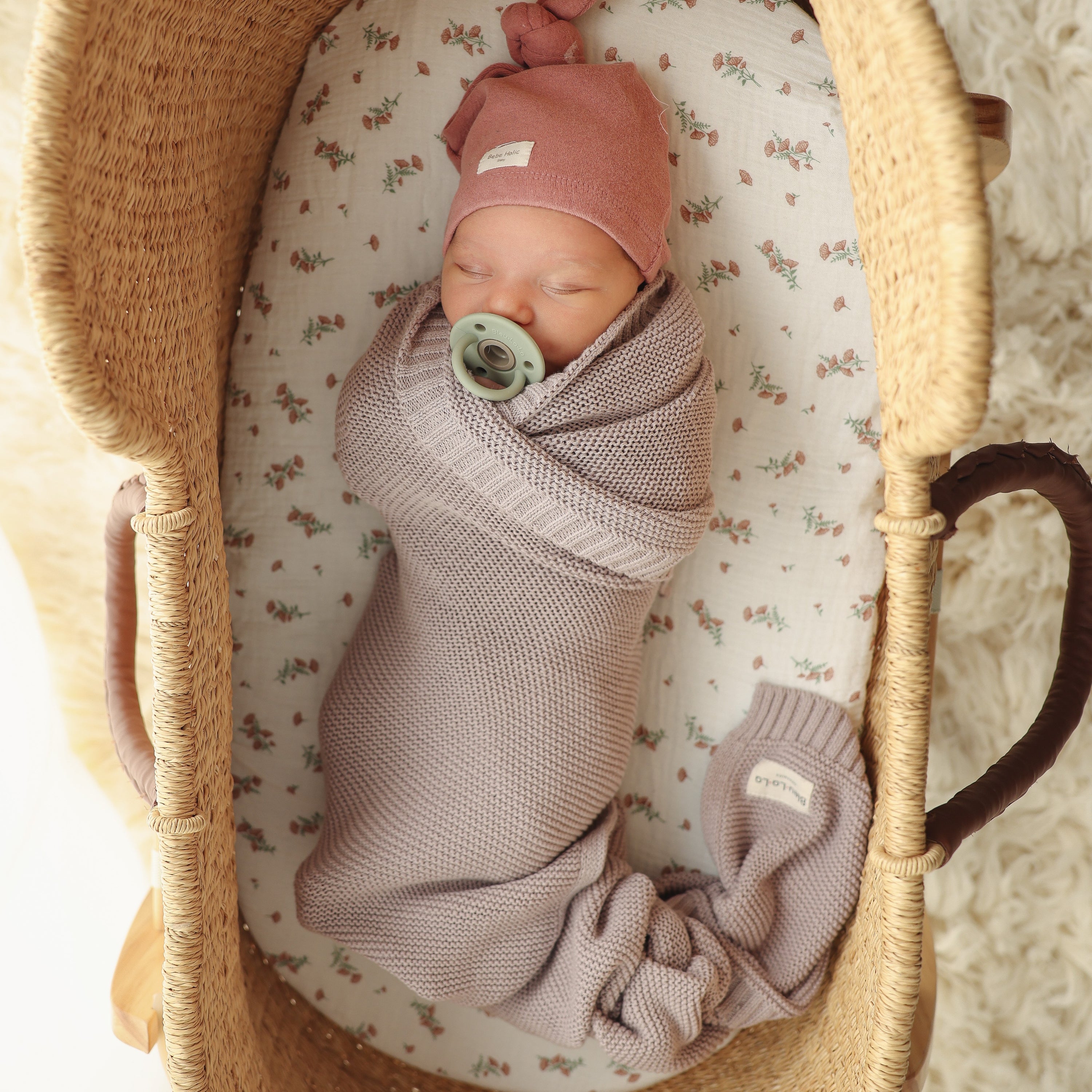 Organic Cotton Luxury Knit Baby Swaddle Blanket in soft pastel colors, showcasing its gentle texture and versatile design for newborns and toddlers.