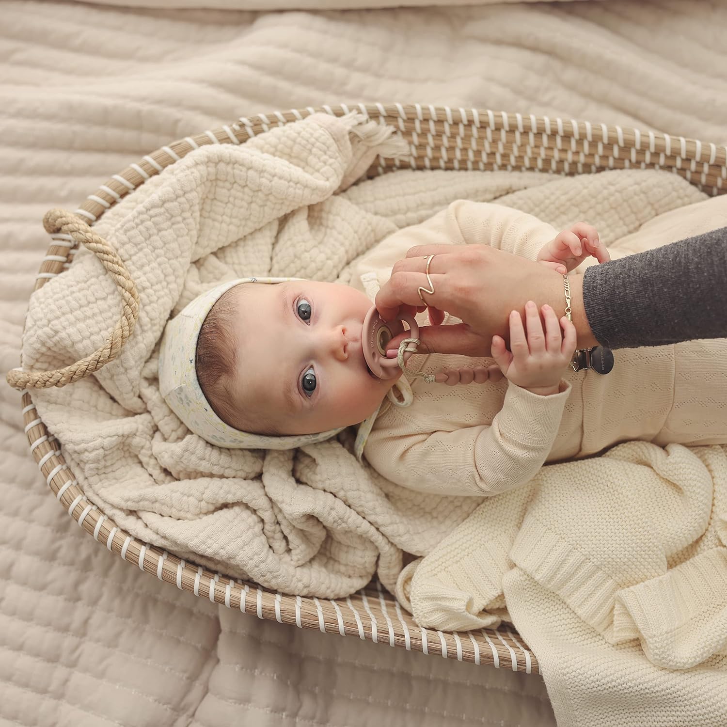 Organic Cotton Luxury Knit Baby Swaddle Blanket in soft pastel colors, showcasing its gentle texture and versatile design for newborns and toddlers.