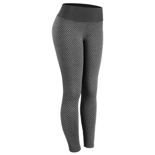 A pair of women's ankle-length push up bubble butt leggings in black, made from stretchy polyester and spandex, designed for a flattering fit.