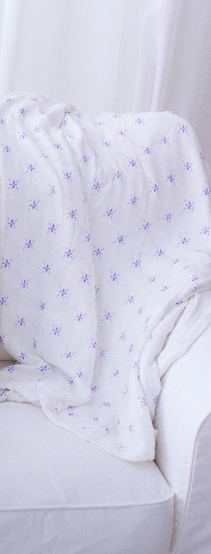 Watercolor Star and White Newcastle Blanket featuring a soft bamboo muslin fabric, designed for kids, measuring 47x47 inches.