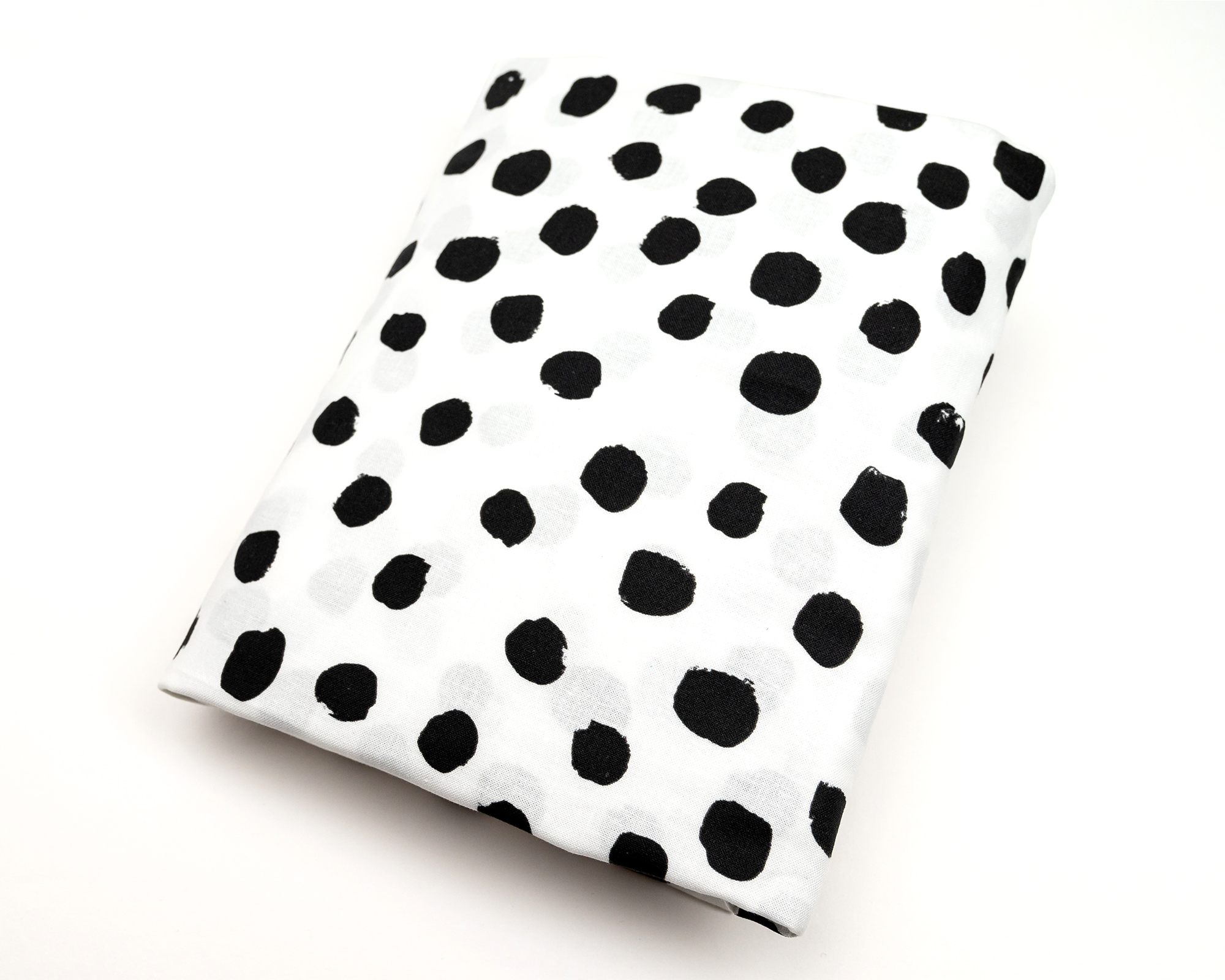 Zoe's Spots & Dots Fitted Crib Sheet featuring a modern black-on-white polkadot design, made from 100% premium cotton.