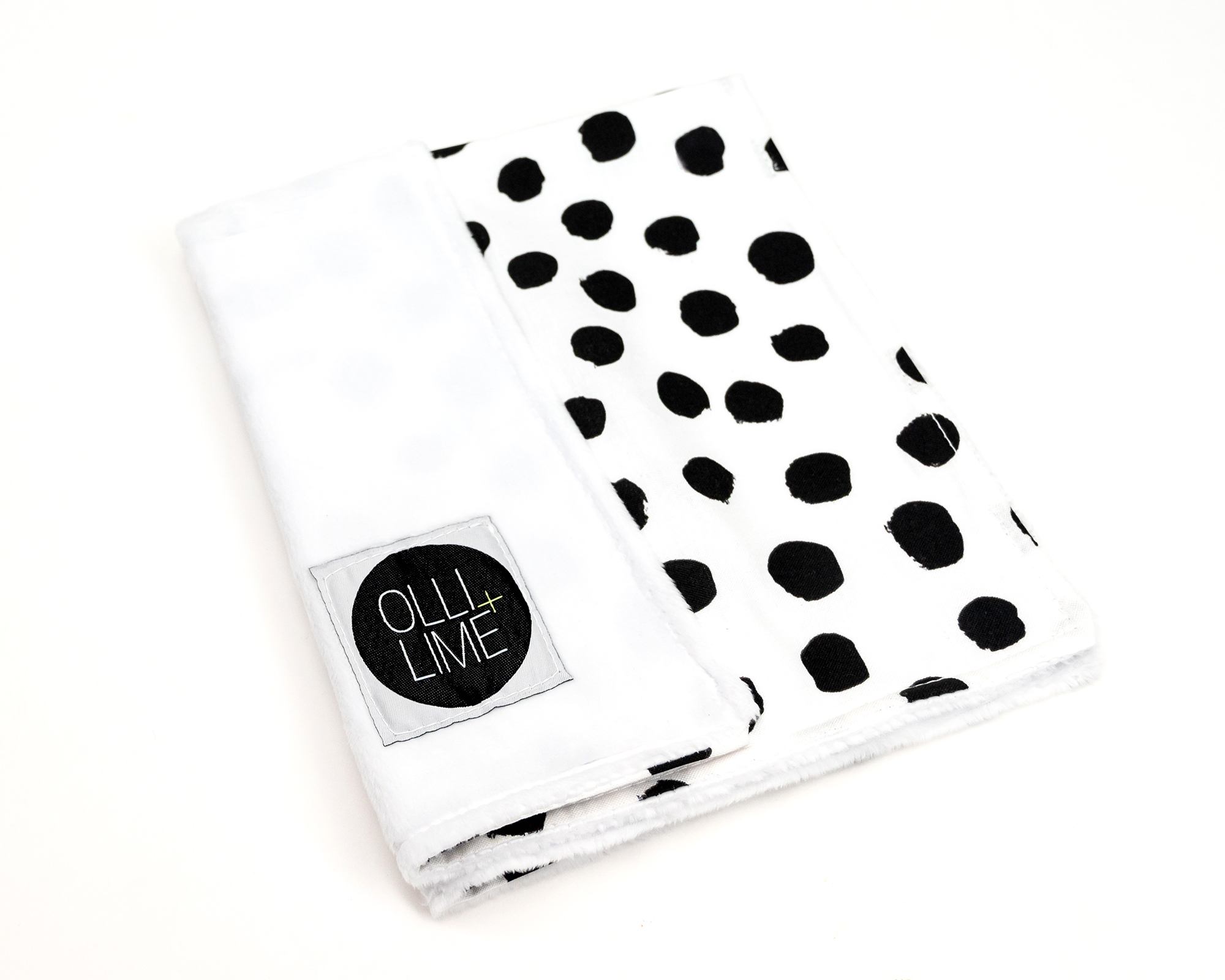 Zoe's Spots & Dots Lovey featuring a modern black and white polka dot design, made from soft premium cotton.