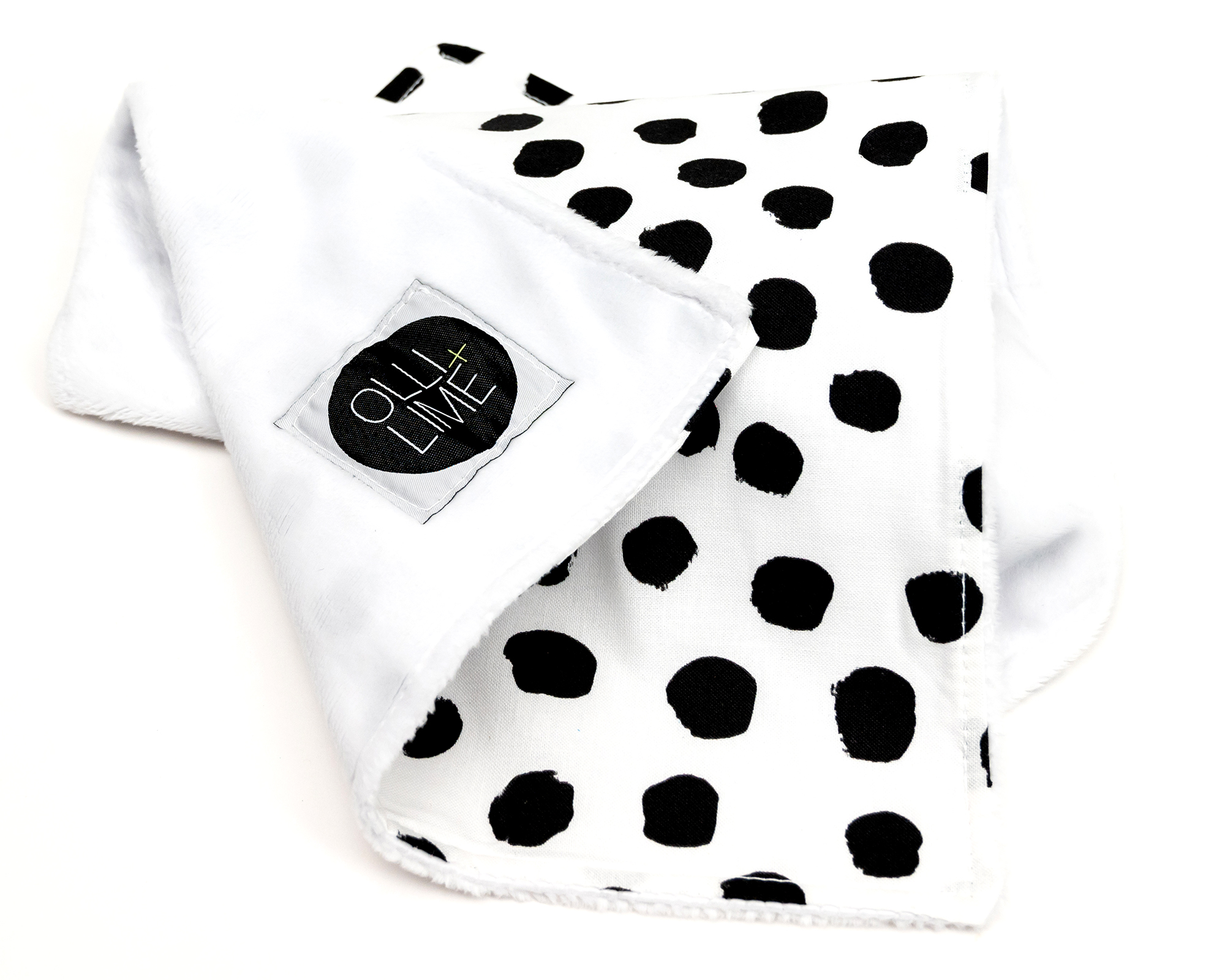 Zoe's Spots & Dots Lovey featuring a modern black and white polka dot design, made from soft premium cotton.