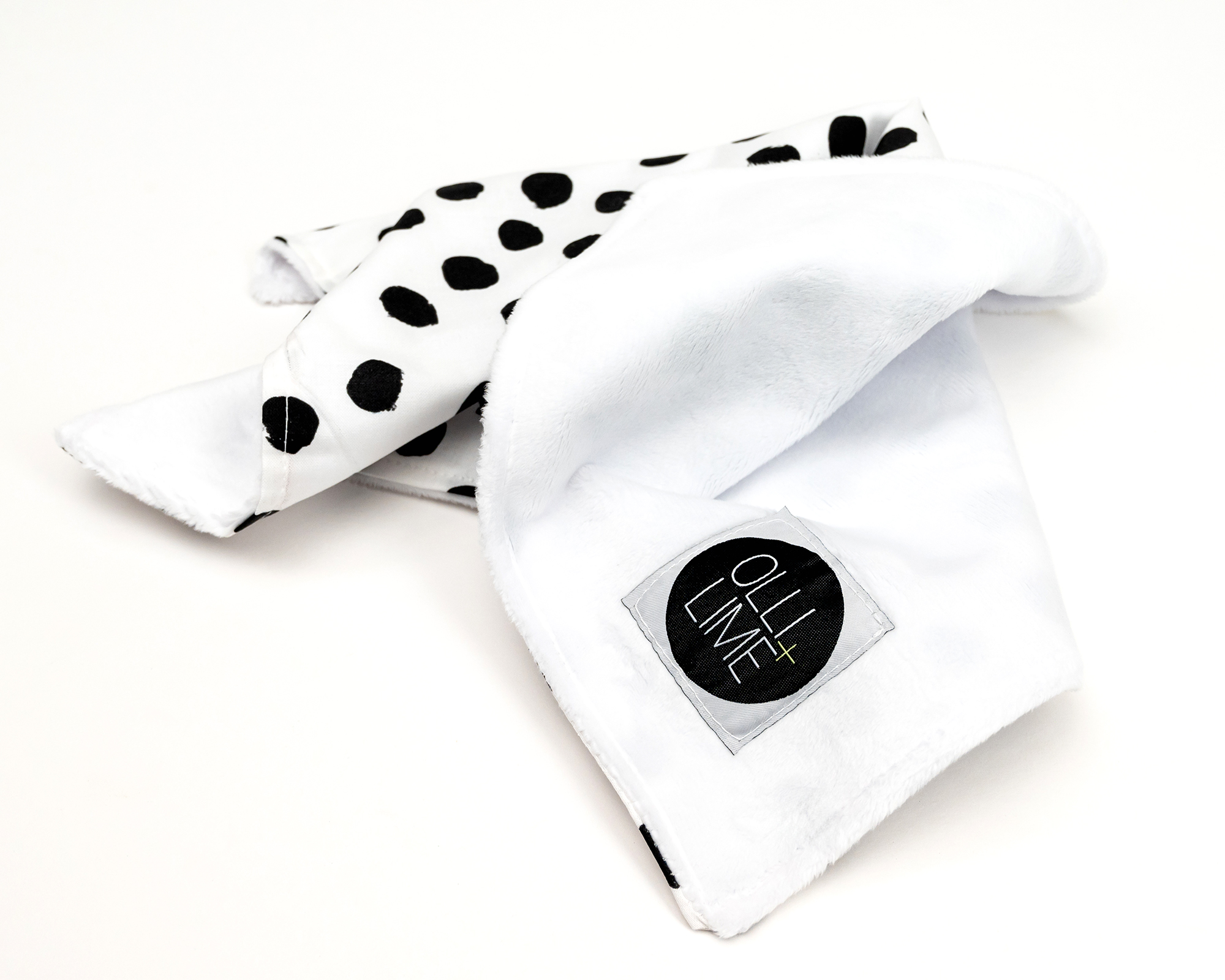 Zoe's Spots & Dots Lovey featuring a modern black and white polka dot design, made from soft premium cotton.