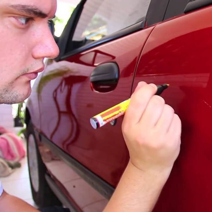 AutoPro Scratch Magic Eraser pen designed for removing car scratches, featuring a sleek design and easy-to-use applicator tip.