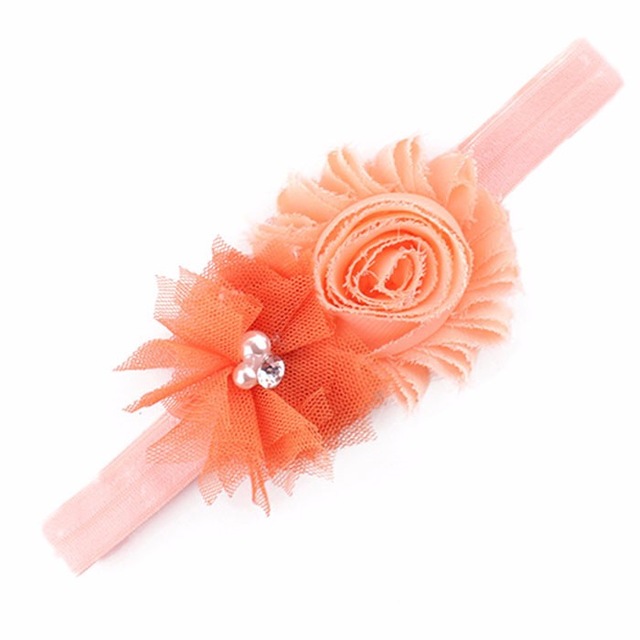 Peach-colored floral headband accessory.