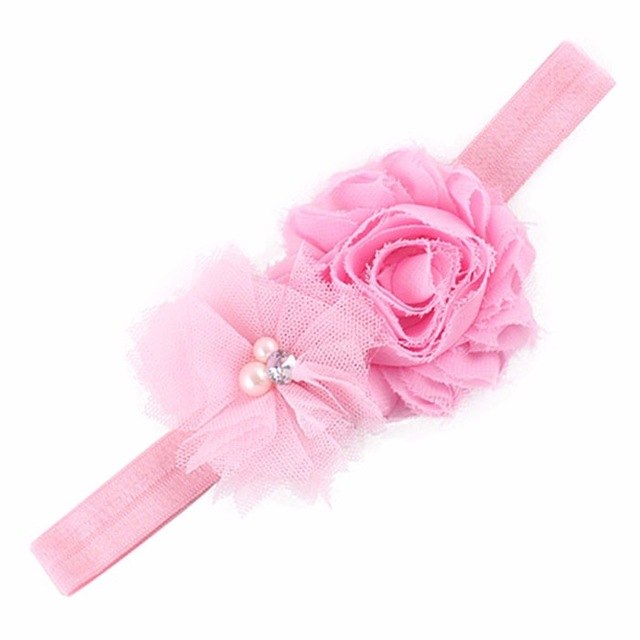 Pink floral headband with pearls.