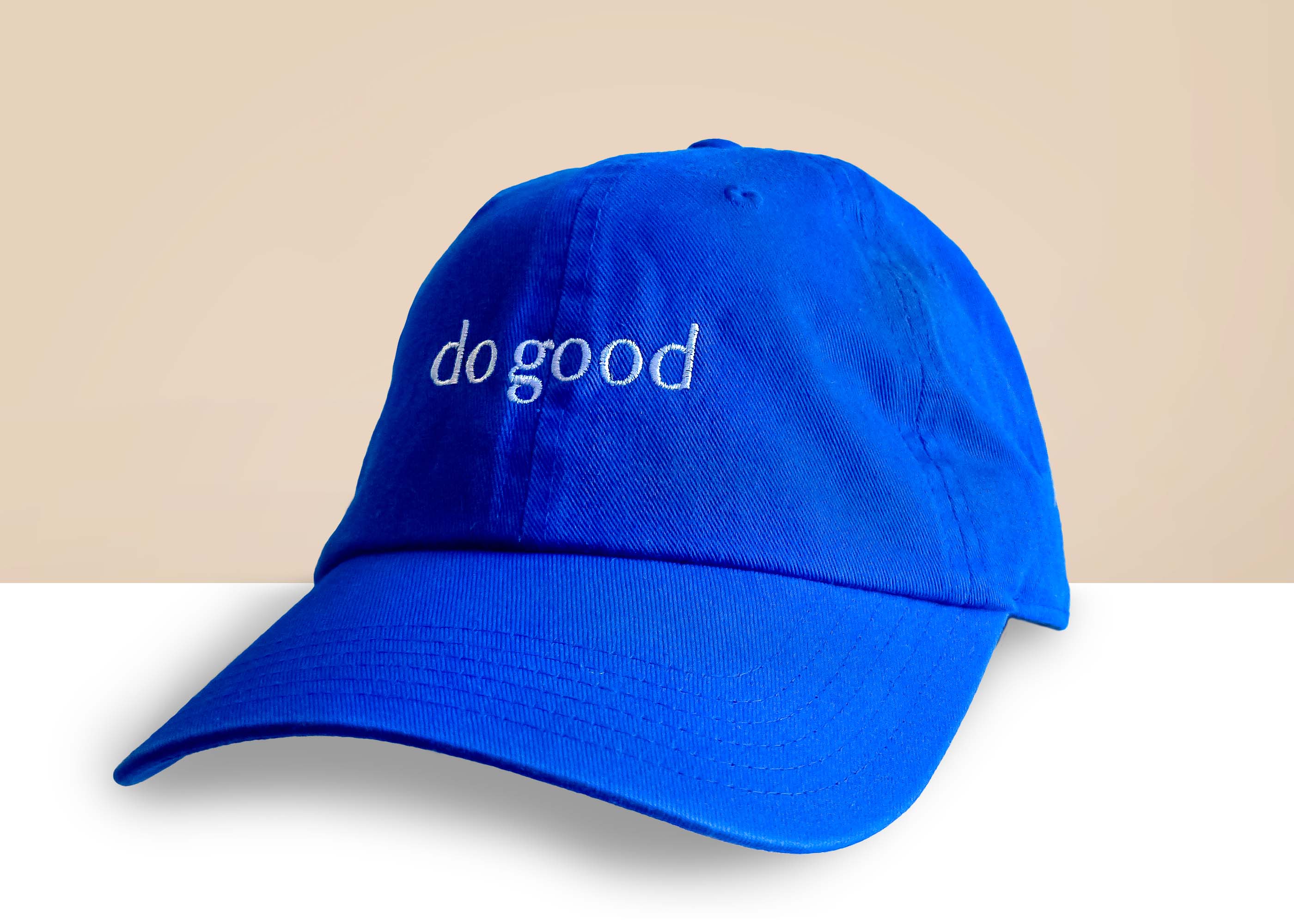 Classic Baseball Hat in Eternal Optimist Cobalt Blue with adjustable strap and 'Do Good' embroidery on the front and back.