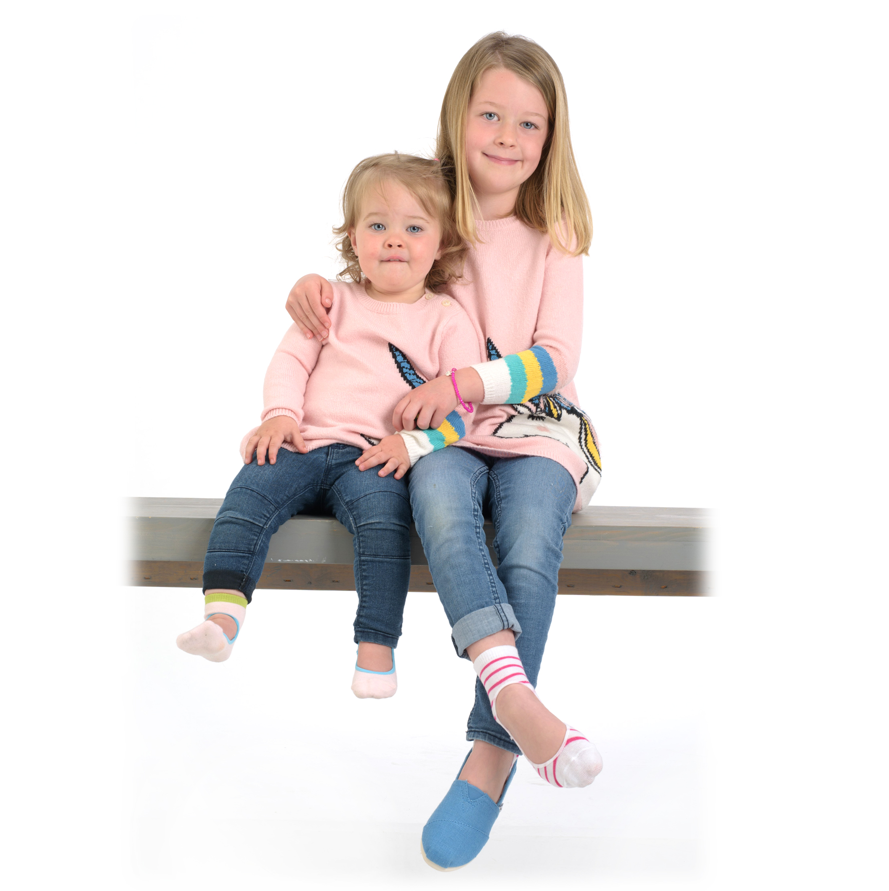 A pair of BabyKeys no-slip socks for babies, featuring a keyhole opening design, made from soft cotton blend material, available in various sizes.